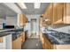 Modern kitchen with granite countertops and oak cabinets, perfect for cooking and entertaining at 4005 Poppy Fields Dr, Las Vegas, NV 89129