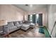 Spacious living room with wood floors and a comfortable sectional sofa at 4005 Poppy Fields Dr, Las Vegas, NV 89129
