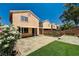 Exterior back view featuring a well-maintained yard and covered patio at 401 Sonoma Valley St, Las Vegas, NV 89144