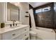 Modern bathroom featuring a sleek vanity, a well lit mirror, and a tiled shower-over-tub at 401 Sonoma Valley St, Las Vegas, NV 89144