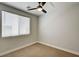 Neutral bedroom featuring a window, carpeted flooring, and ample natural light at 401 Sonoma Valley St, Las Vegas, NV 89144