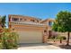 Charming two-story home featuring a tile roof, desert landscaping, and an attached two-car garage at 401 Sonoma Valley St, Las Vegas, NV 89144