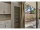 Bright kitchen with cabinets, and view to outdoor patio at 401 Sonoma Valley St, Las Vegas, NV 89144