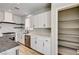 Well-organized kitchen with white cabinets, shelving, and stainless steel appliances at 401 Sonoma Valley St, Las Vegas, NV 89144