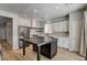 Well-appointed kitchen featuring white cabinets and a central island at 401 Sonoma Valley St, Las Vegas, NV 89144
