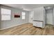 Open floor plan featuring modern wood flooring, white dresser, and lots of natural light at 401 Sonoma Valley St, Las Vegas, NV 89144