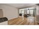 Open living room with wood floors and views into the yard at 401 Sonoma Valley St, Las Vegas, NV 89144
