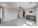 Spacious main bedroom with neutral walls, carpet flooring, ceiling fan, dresser, and door to the main bathroom at 401 Sonoma Valley St, Las Vegas, NV 89144