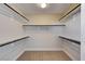 Empty walk-in closet, ready for your personal storage solutions, with carpeted floor and white shelving at 401 Sonoma Valley St, Las Vegas, NV 89144