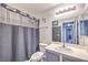 Bathroom featuring a shower/tub combo, vanity with sink and mirror at 4037 Asante Cove St, Las Vegas, NV 89115