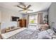 Comfortable bedroom with natural light, ceiling fan and neighborhood views at 4037 Asante Cove St, Las Vegas, NV 89115