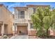 Charming two-story home boasts a balcony, well-maintained exterior, and beautiful desert landscaping, complete with cozy patio seating at 4037 Asante Cove St, Las Vegas, NV 89115