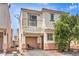 Charming two-story home boasts a balcony, well-maintained exterior, and beautiful desert landscaping, complete with cozy patio seating at 4037 Asante Cove St, Las Vegas, NV 89115