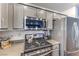 Well-equipped kitchen with stainless steel appliances, modern cabinets, and sleek countertops, perfect for cooking enthusiasts at 4037 Asante Cove St, Las Vegas, NV 89115