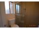 A bathroom with modern shower featuring glass doors and tiled walls at 4354 Thorndale Pl, Las Vegas, NV 89103