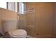 A bathroom with modern shower featuring glass doors and tiled walls at 4354 Thorndale Pl, Las Vegas, NV 89103