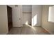 This is a light and bright bedroom with modern light-colored floors and closet with sliding doors at 4354 Thorndale Pl, Las Vegas, NV 89103