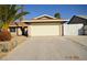 Inviting single-story home featuring a two-car garage and well-maintained desert landscape at 4354 Thorndale Pl, Las Vegas, NV 89103