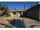 Single-story home with desert landscaping and a pathway leading to the front door at 4354 Thorndale Pl, Las Vegas, NV 89103