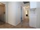 Hallway view with laundry room and fireplace in the living room at 4354 Thorndale Pl, Las Vegas, NV 89103