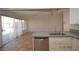 Renovated kitchen with stainless steel appliances, backyard view, and gray countertops at 4354 Thorndale Pl, Las Vegas, NV 89103