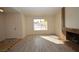 Inviting living room boasts wood-look floors, fireplace, and a sunlit window at 4354 Thorndale Pl, Las Vegas, NV 89103