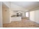 Open-concept living room and kitchen features stainless steel appliances and tile floors at 4354 Thorndale Pl, Las Vegas, NV 89103