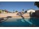 Inviting pool offering a refreshing escape in a private backyard setting surrounded by palm trees at 4354 Thorndale Pl, Las Vegas, NV 89103