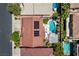 Overhead view of house with solar panels, pool, patio furniture, desert landscaping, & neighboring properties at 464 Beardsley Cir, Henderson, NV 89052
