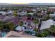 Lovely aerial shot showcasing the pool and outdoor living area in the backyard of the house and neighborhood at 464 Beardsley Cir, Henderson, NV 89052