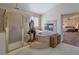 Serene bathroom with a standalone tub, glass shower, and access to the bedroom, creating a private retreat at 464 Beardsley Cir, Henderson, NV 89052