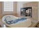 Modern bathtub with a built-in fireplace and granite surround, creating a cozy and luxurious bathing experience at 464 Beardsley Cir, Henderson, NV 89052