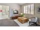 Cozy bedroom with a fireplace, a decorative coffee table and sitting area, creating a comfortable and inviting space at 464 Beardsley Cir, Henderson, NV 89052