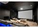 Private home theater with comfortable seating, a large projection screen, and surround sound for an immersive experience at 464 Beardsley Cir, Henderson, NV 89052