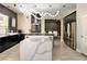 Modern kitchen with black and gold accents and a large white island at 464 Beardsley Cir, Henderson, NV 89052