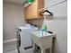 Laundry room featuring a washing machine, a sink, and wooden cabinets for storage at 464 Beardsley Cir, Henderson, NV 89052
