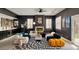 Contemporary living room boasts modern furniture, fireplace, and unique decor at 464 Beardsley Cir, Henderson, NV 89052
