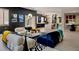 Modern living room with stylish furniture, light wood floors and a view into the kitchen at 464 Beardsley Cir, Henderson, NV 89052