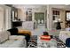 Open concept living room and kitchen with modern decor and stylish furniture at 464 Beardsley Cir, Henderson, NV 89052