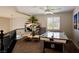 A loft space featuring an air hockey table and a comfortable seating area, perfect for entertainment and relaxation at 464 Beardsley Cir, Henderson, NV 89052