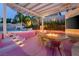 Backyard features a refreshing pool and outdoor seating area with a built-in fire pit at 464 Beardsley Cir, Henderson, NV 89052