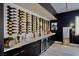 Beautiful wet bar with wine storage, display shelves and cooler at 464 Beardsley Cir, Henderson, NV 89052