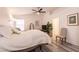 Comfortable bedroom with soft lighting, neutral tones, and minimalist decor creating a cozy space at 5028 Glenarden Dr, Las Vegas, NV 89130
