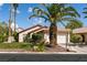 Charming single-story home with well-maintained lawn, desert landscaping, and a spacious two-car garage at 5028 Glenarden Dr, Las Vegas, NV 89130