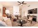 Spacious living room with a fireplace, entertainment center, and comfortable seating, perfect for gatherings at 5028 Glenarden Dr, Las Vegas, NV 89130