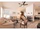 Cozy living room featuring a fireplace, neutral tones, and comfortable furnishings for a relaxing ambiance at 5028 Glenarden Dr, Las Vegas, NV 89130
