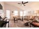 Comfortable living room with lots of seating, flooded with natural light, and stylish decor at 5028 Glenarden Dr, Las Vegas, NV 89130