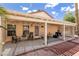Covered patio featuring a pergola with seating, creating an inviting outdoor living space at 5028 Glenarden Dr, Las Vegas, NV 89130