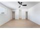 This bare bedroom features a ceiling fan, two closets and one window at 5069 Hallet Dr, Las Vegas, NV 89122