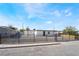 Charming single-story home featuring secure fencing, a modern aesthetic, and well-maintained landscaping at 5069 Hallet Dr, Las Vegas, NV 89122
